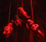 Hanging Babies 2 -  Dollhaus Gallery's "Terrible Toy Fair" party, Williamsburg, Brooklyn. March 1, 2003. www.dollhaus.com