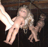 Hanging Babies 3 -  Dollhaus Gallery's "Terrible Toy Fair" party, Williamsburg, Brooklyn. March 1, 2003. www.dollhaus.com