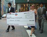 Billionaires March to GOP headquarters Delivering Check (from left - Austin Tatious, Robin Moore Poore & Rev. Dr. Cassius King