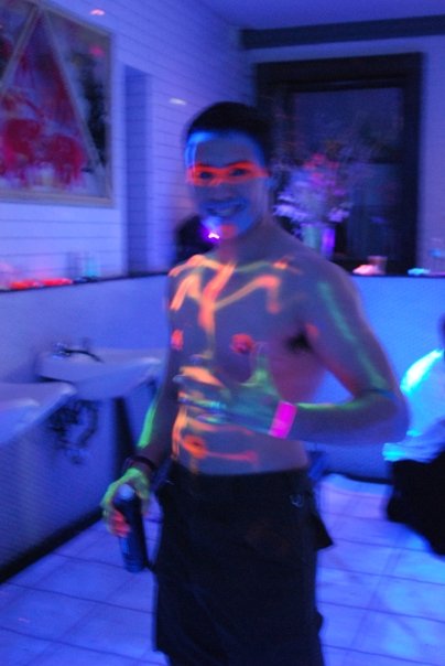 Black light body painting in the Psychedelic Salon