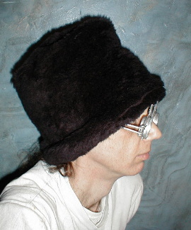 fuzzy stovepipe head - this is me in one of my warmest hats made from faux fur inside and out.I make them for about$20.
e-mail me:brooksdesign@mail.gbronline.com
