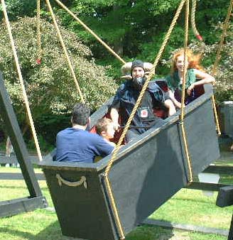 Last Ride - Eva and Tim in a swinging Coffin. NY Renaissance Faire at Sterling Forest, Tuxedo NY, 2001