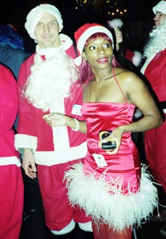 Santa Beauty and stalker - NYC SantaCon 2000