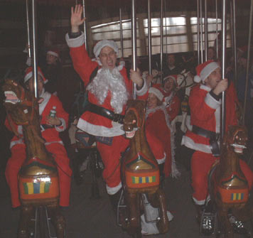 Santas go round - NYC SantaCon, 2002