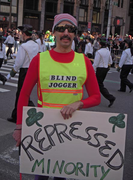 When I handed him the sign, a cop saw him reading it and pushed him to the side of the parade!