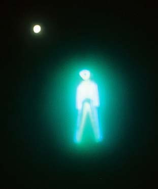 Surreal Man & Full Moon - The night b4 the Burn.  Taken with an ordinary "point & click" during a dust storm at Burning Man 2001.