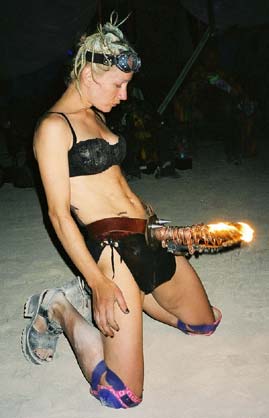 Flaming Phallus - Fire Dancer Blue at Burning Man 2001.  To edit record e-mail Editor@CostumeNetwork.com.
