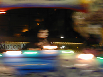 Druid Parade - One of the druids on a float blurred as they roll forward.