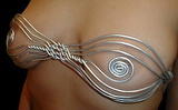 wrap around wire bra - this is a piece that can be worn with or without straps... 
 hand made by brooks coleman for $100