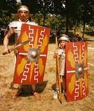 Recruit Them Young for Rome! - An axium of Commander Marsallas is "Recruit Them Young for Rome".  Here in Newstead Lorica (armor), he stands "Duty" with a youthful legionary at Historic Fort Malden, Amherstburg, Ont in 1998.