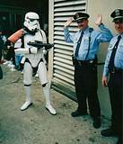 Hands Up !  The Empire is in charge Now !! - Trooper "Oberon" TK124, 501st,ECG; takes control of the local New Orleans "gendarmes" at MardiGras 2000.  See more of TK124 and other SW characters at www.legionxxiv.org/trooper124