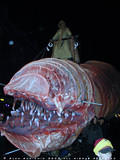 Dune sand worm - A Fremen from the Planet Arrakis (Dune) rides atop the Shai Hulud or ginat sandworm. The Scifi.com float from NYC parade 2000