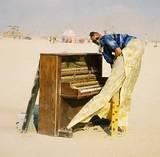 Stilted Pianist - Burning Man 2001. To edit, email editor@costumenetwork.com