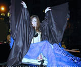 Vampire Mermaid - Beautiful Vampire Mermaid seated atop a sports car at the NYC Halloween parade 2000.