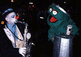 Oscar the Grouch - Oscar grooving to the Sesame Street theme in the New York City Halloween Parade.  Home-Made costume made from Christams tree streamers, cardboard, wire coathangers, glue and tape.